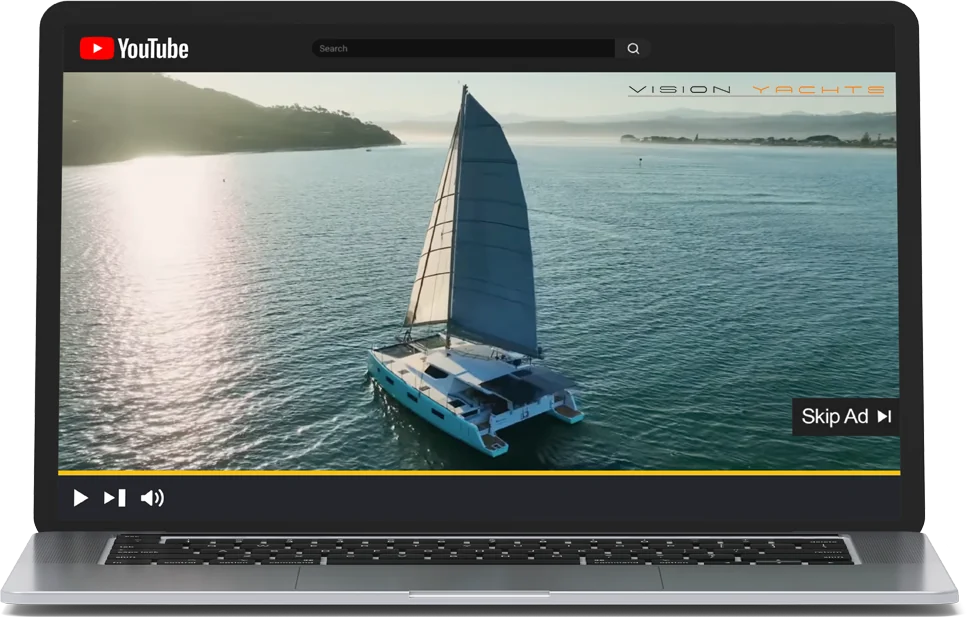 a vision yachts video ad playing on youtube, shown on a laptop