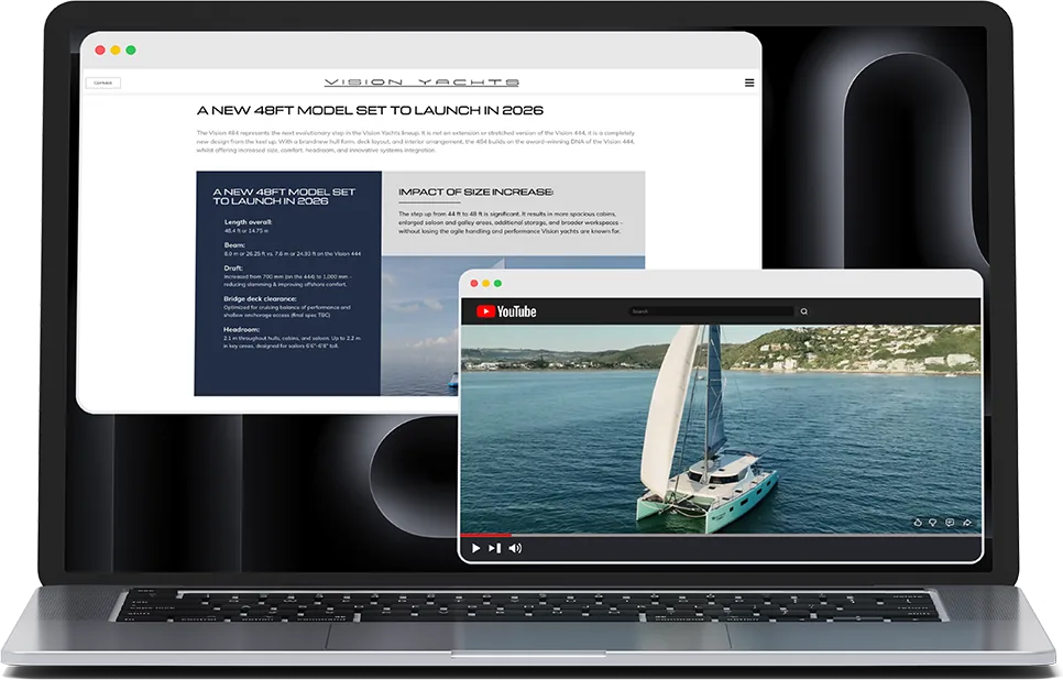 a vision yachts web page and a sailing video on a laptop