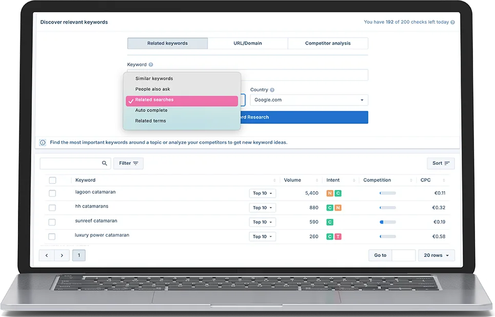 a keyword research tool on a laptop listing catamaran keywords with volume and cpc